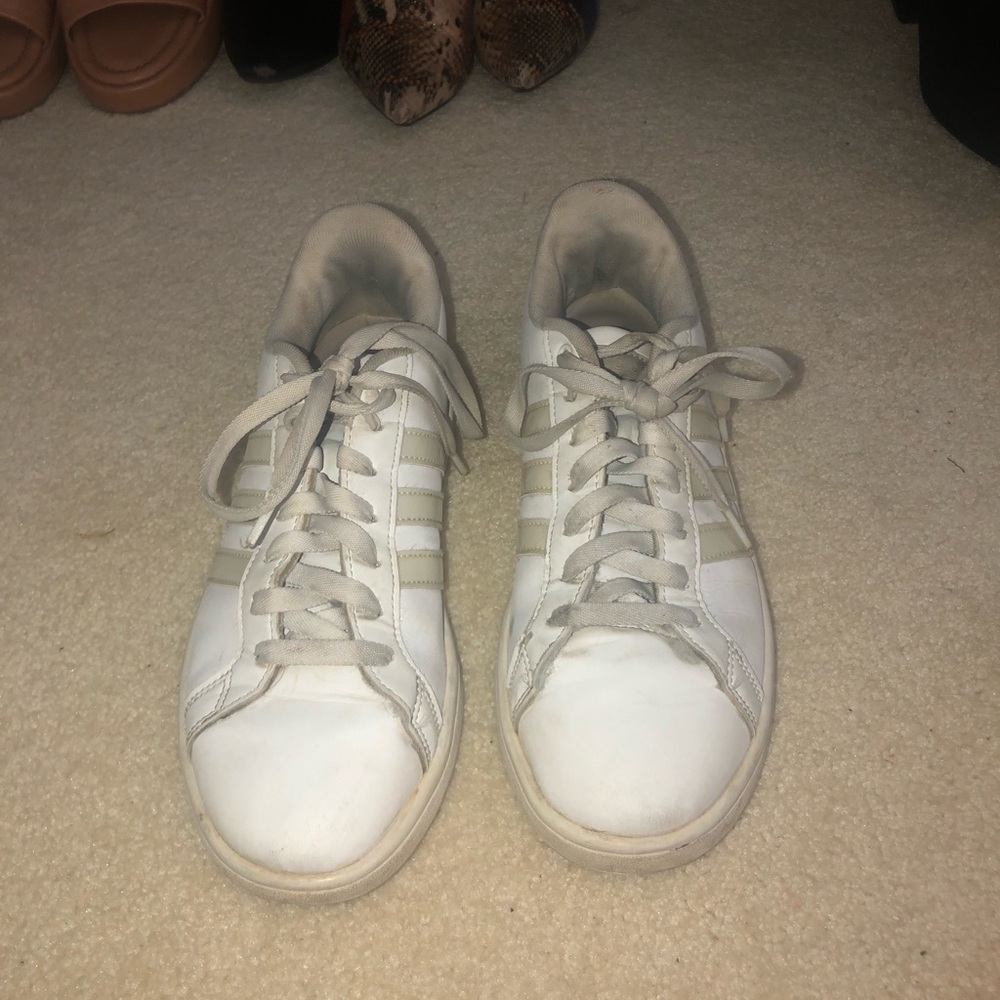 White Adidas Womens sneaker with holographic details. Size 9.